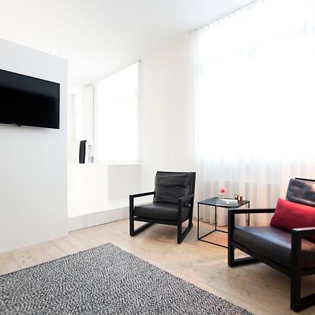 Maison Nationale City Flats & Suites Antwerpen Phòng bức ảnh A room at the hotel