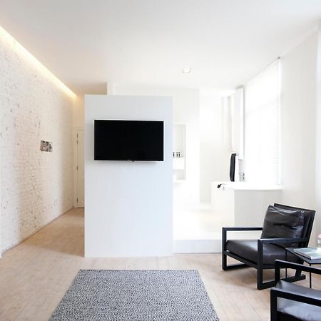 Maison Nationale City Flats & Suites Antwerpen Phòng bức ảnh A room at the hotel