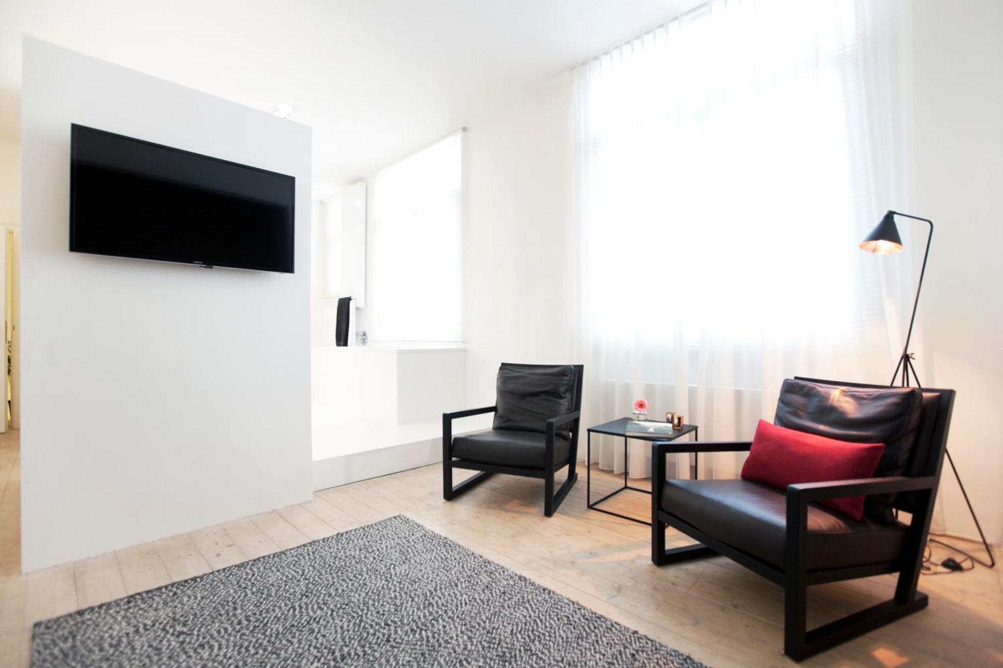 Maison Nationale City Flats & Suites Antwerpen Phòng bức ảnh A room at the hotel